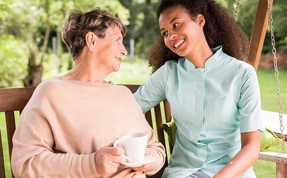 A-Caregiver-Smiling-with-a-Senior-Woman